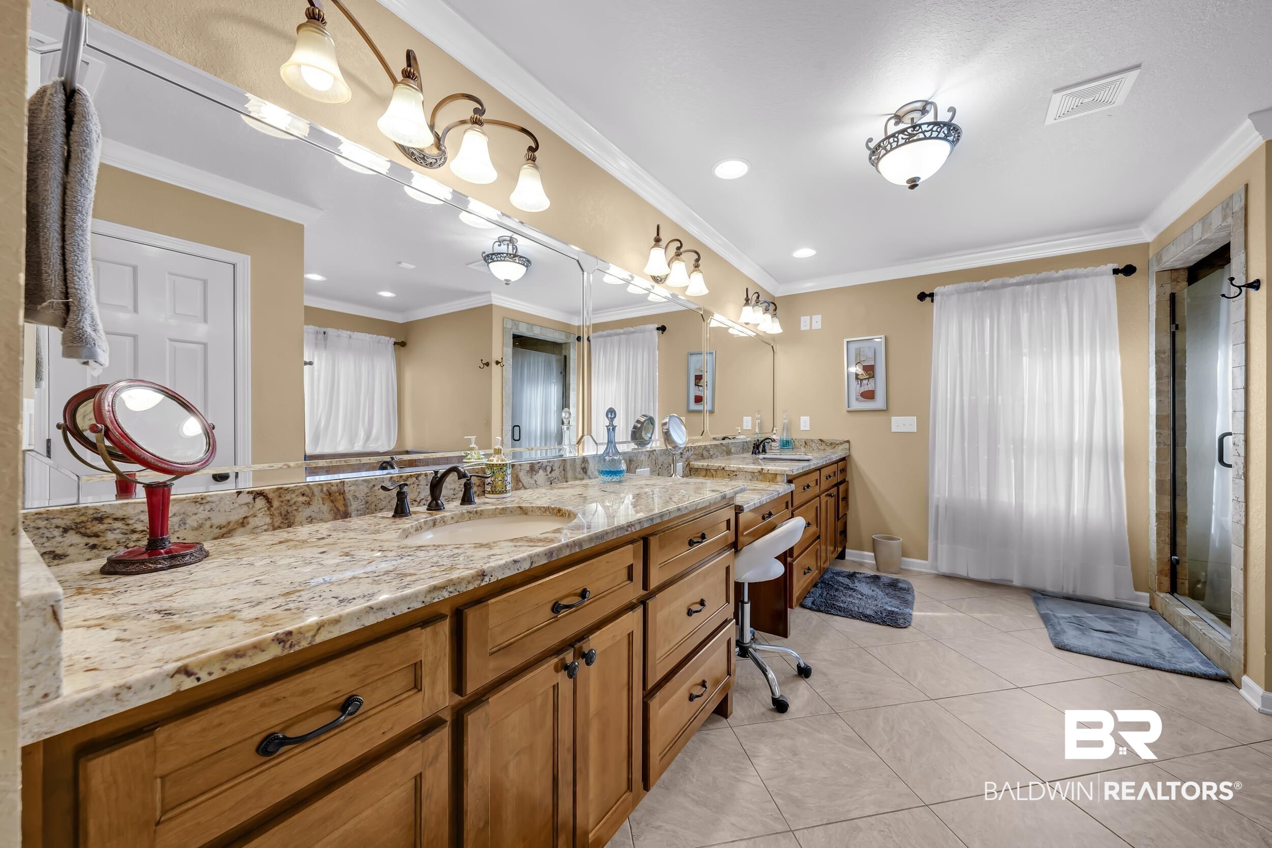 22929 Highway 98 Foley, AL 36535 - Photo 17 of 54 Bathroom with vanity, crown molding, light tile patterned floors, recessed lighting, and a shower with door