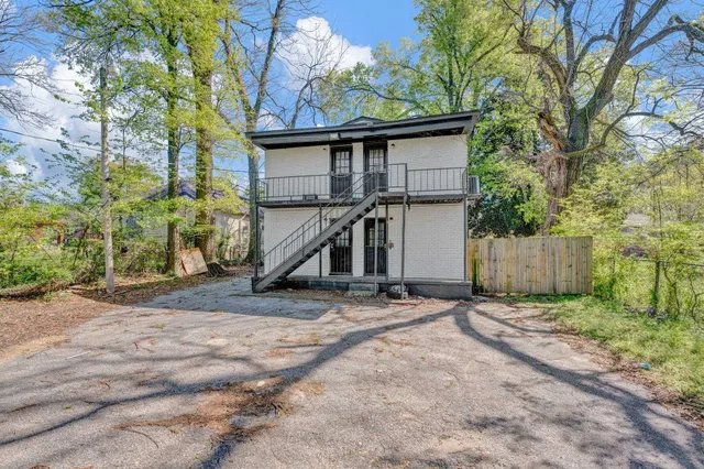 a view of a house with a back yard