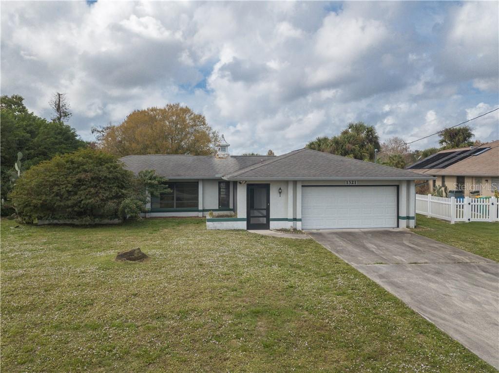 PRICED TO SELL! GREAT INVESTMENT OPPORTUNITY! Two-bedroom, 2 bath canal front home on just over  acre in quiet Port Charlotte neighborhood.