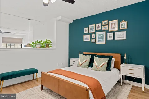 a bedroom with a bed and a window