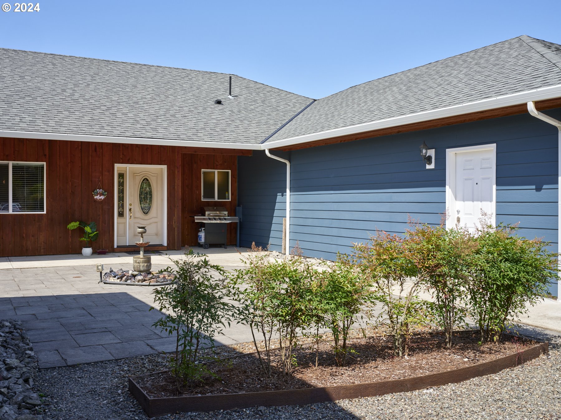 29902 Northwest 51st Avenue Ridgefield, WA 98642 - Photo 1 of 46 a front view of a house with garden