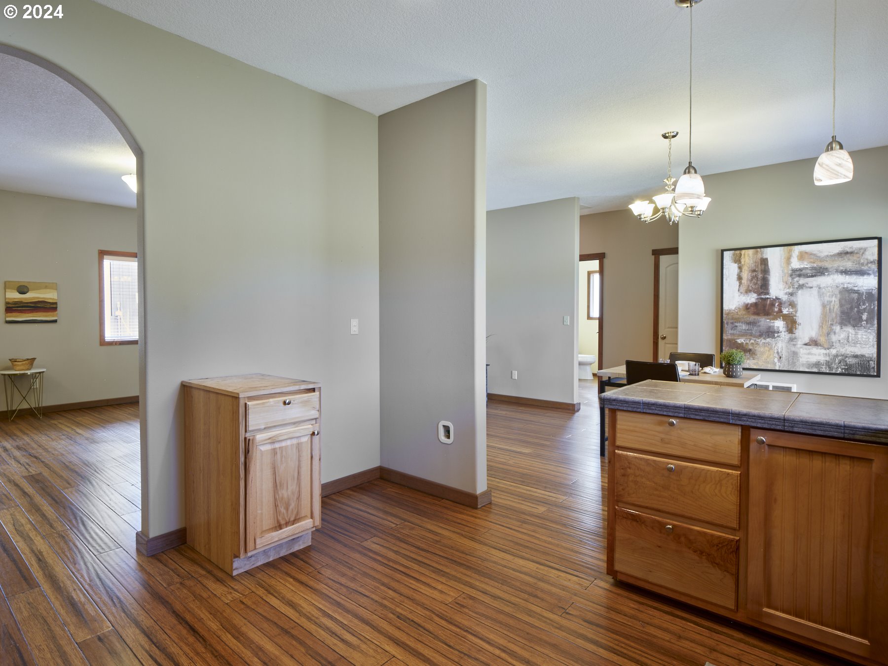 29902 Northwest 51st Avenue Ridgefield, WA 98642 - Photo 16 of 46 a room with wooden floors and wooden cabinets