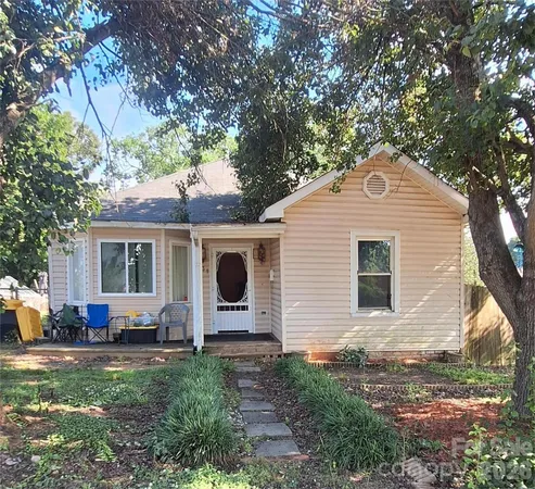 a front view of house with yard and seating area