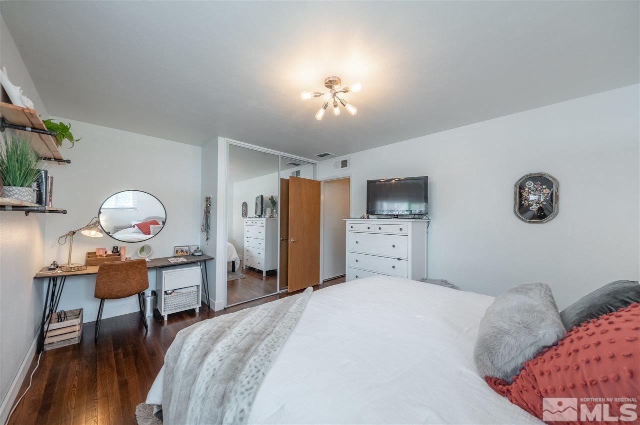 835 Ruby Avenue Reno, NV 89503 - Photo 11 of 18 a bedroom with a bed and a table in it