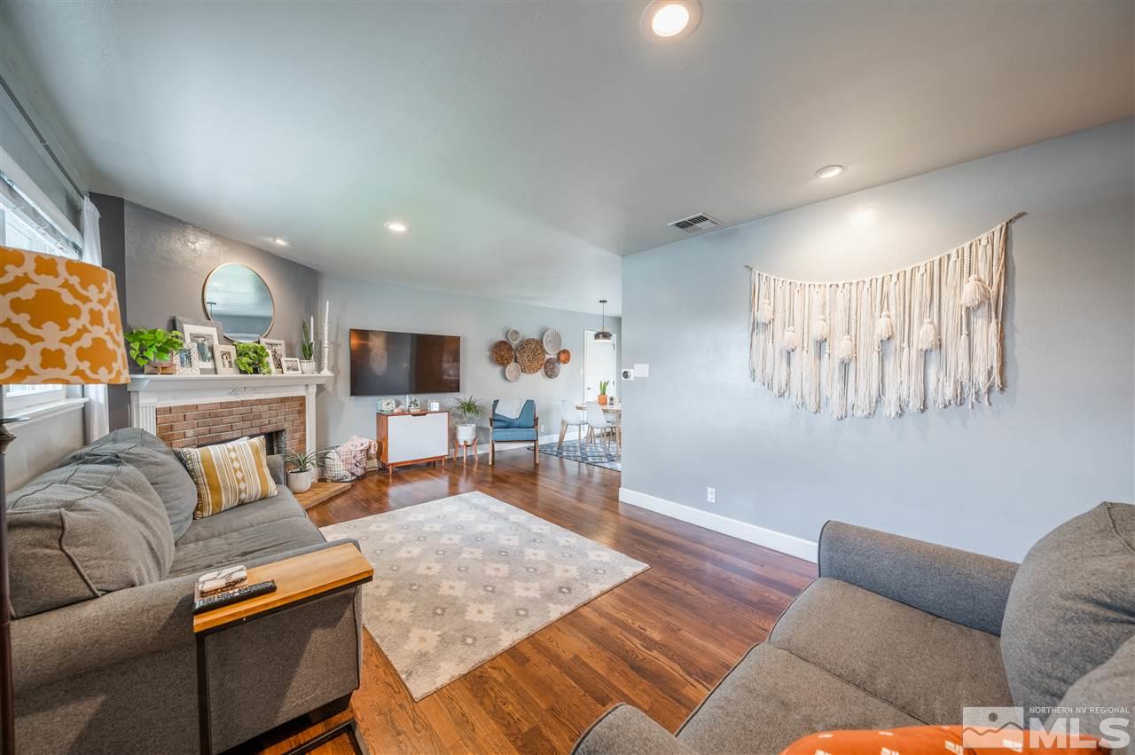 835 Ruby Avenue Reno, NV 89503 - Photo 2 of 18 a living room with furniture and a flat screen tv