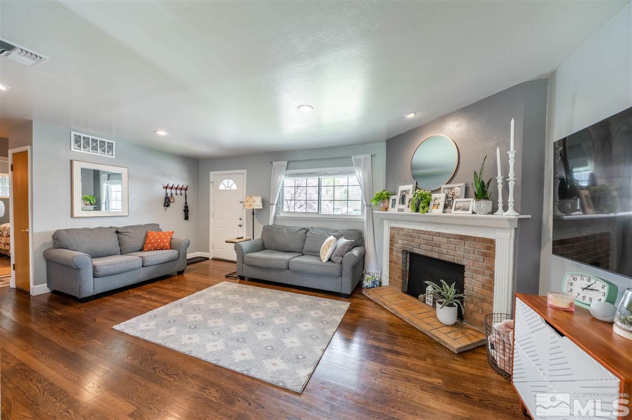 835 Ruby Avenue Reno, NV 89503 - Photo 4 of 18 a living room with furniture and a fireplace