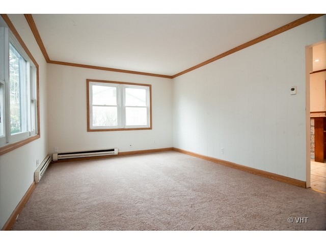 102 Louis Road Joliet, IL 60433 - Photo 2 of 10 a view of an empty room with a window
