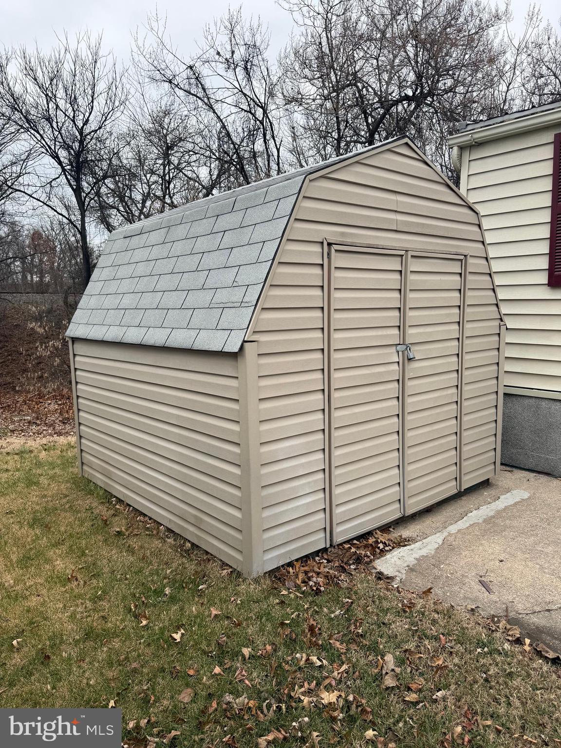478 Mirabile Lane Baltimore, MD 21224 - Photo 4 of 23 a view of a white house with a small yard and large trees