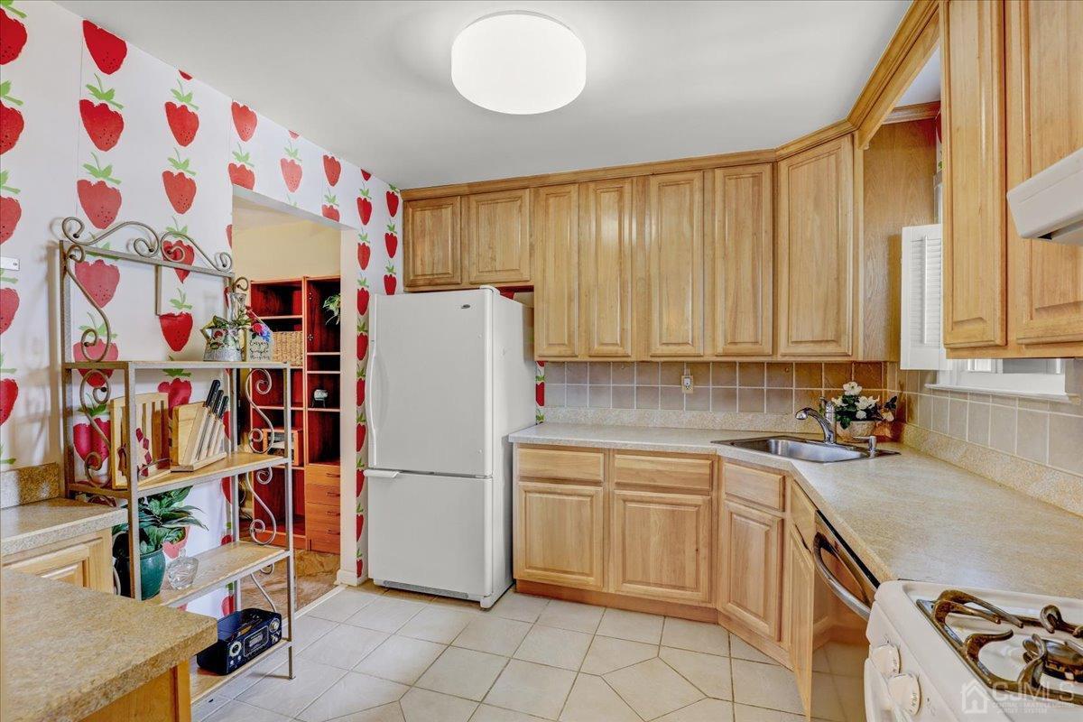 95 Neilly Court Old Bridge, NJ 08857 - Photo 12 of 35 a kitchen with appliances cabinets and a sink