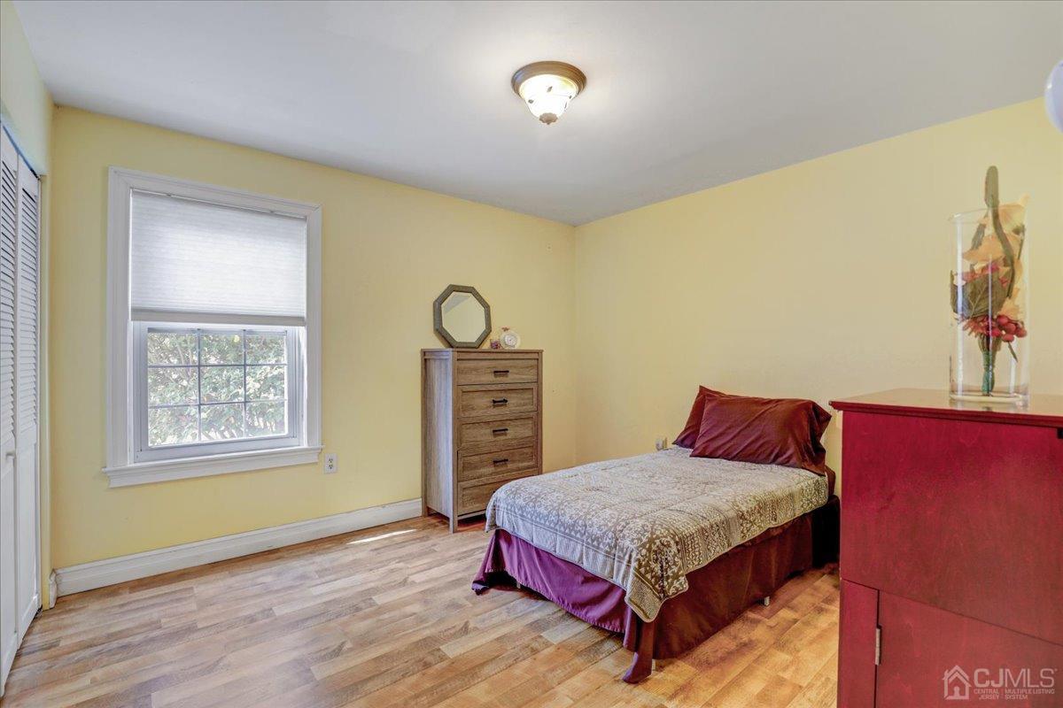 95 Neilly Court Old Bridge, NJ 08857 - Photo 19 of 35 a bedroom with a bed and a window