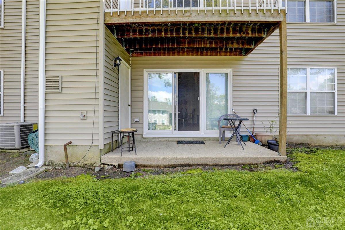 95 Neilly Court Old Bridge, NJ 08857 - Photo 24 of 35 a view of a chair and table in the backyard