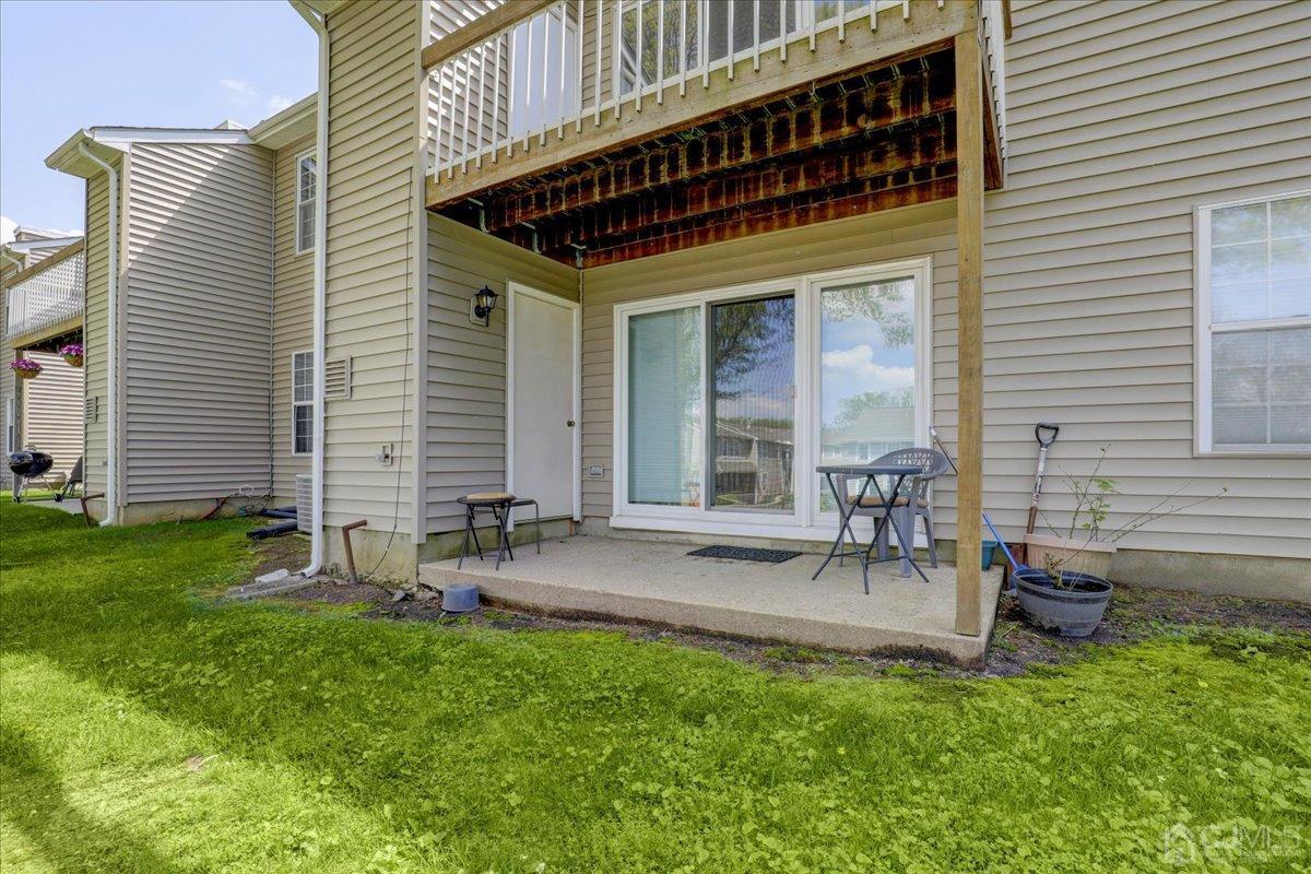 95 Neilly Court Old Bridge, NJ 08857 - Photo 25 of 35 a view of a chair and table in backyard of the house