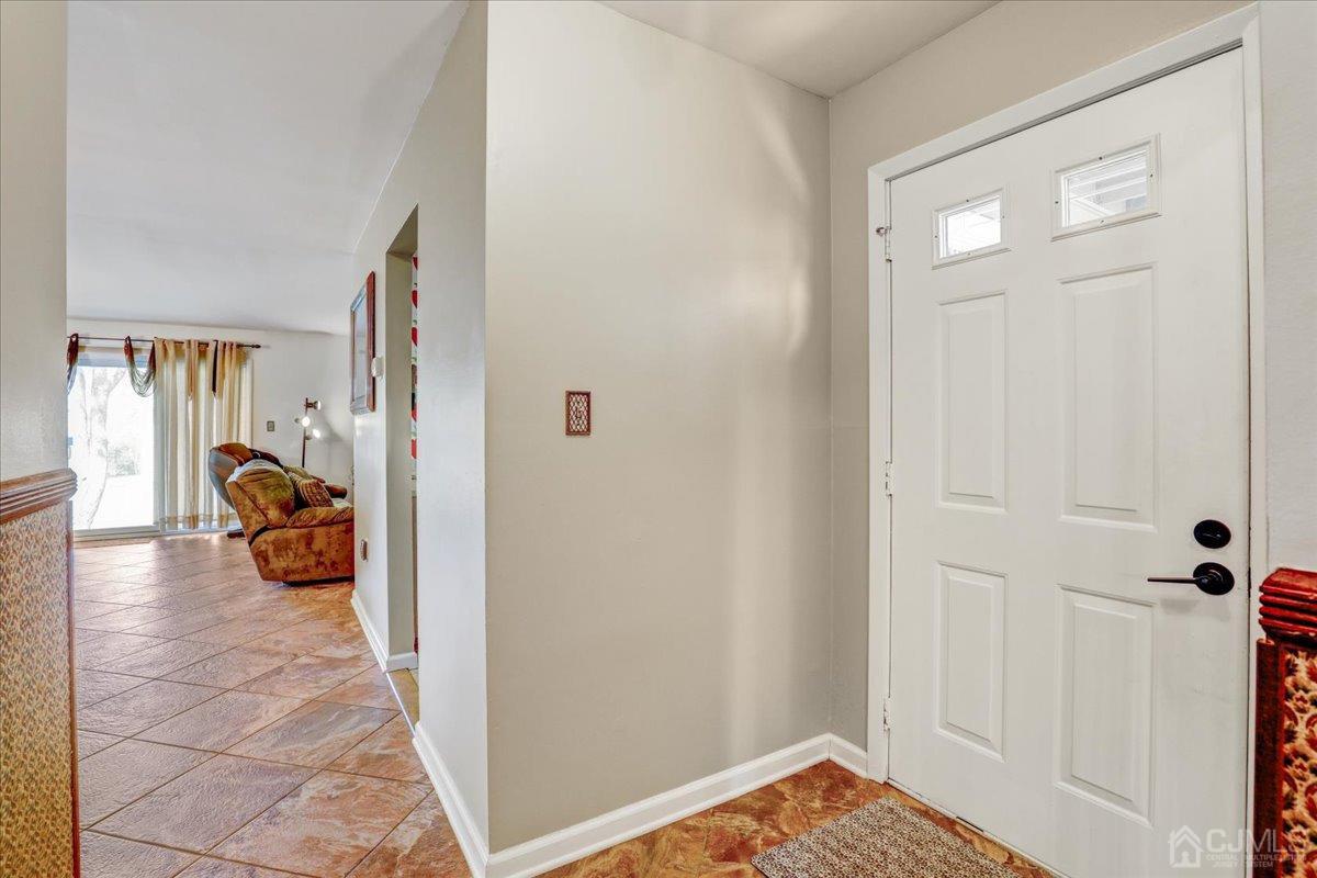 95 Neilly Court Old Bridge, NJ 08857 - Photo 3 of 35 a view of a hallway and a livingroom with couch