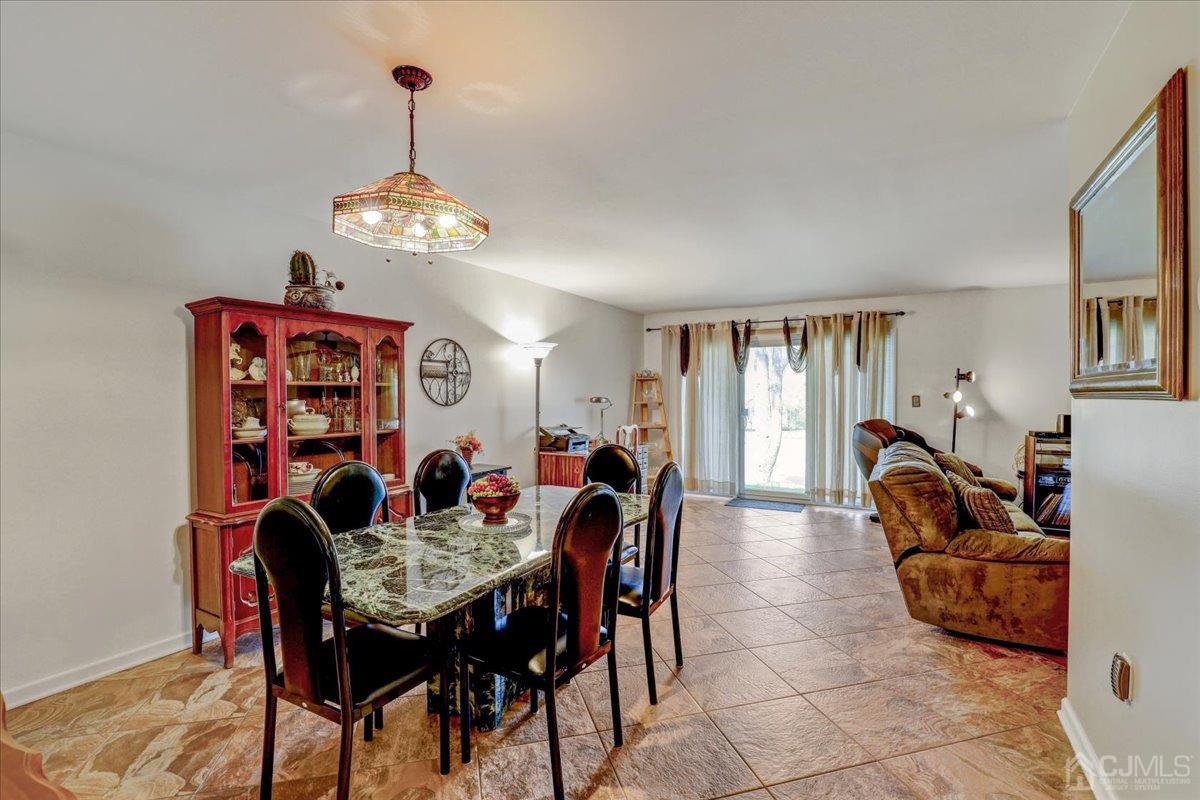 95 Neilly Court Old Bridge, NJ 08857 - Photo 4 of 35 a dining room with furniture and window