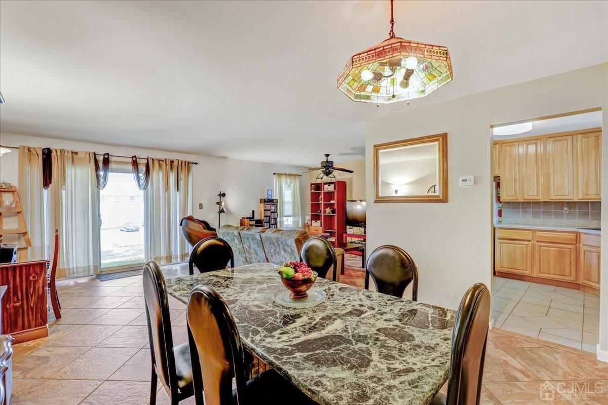95 Neilly Court Old Bridge, NJ 08857 - Photo 6 of 35 a view of a dining room with furniture and chandelier