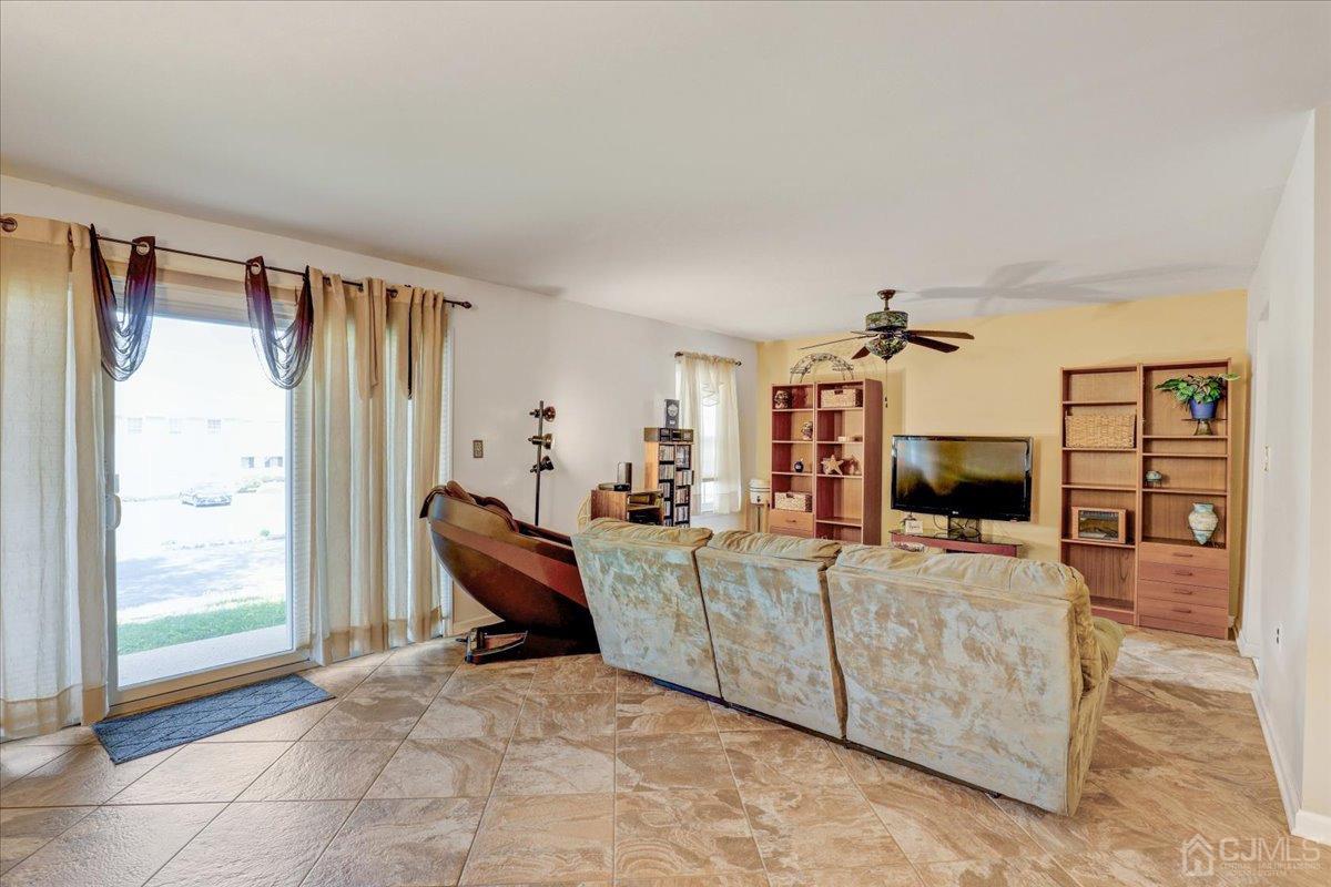 95 Neilly Court Old Bridge, NJ 08857 - Photo 7 of 35 a living room with furniture and a flat screen tv