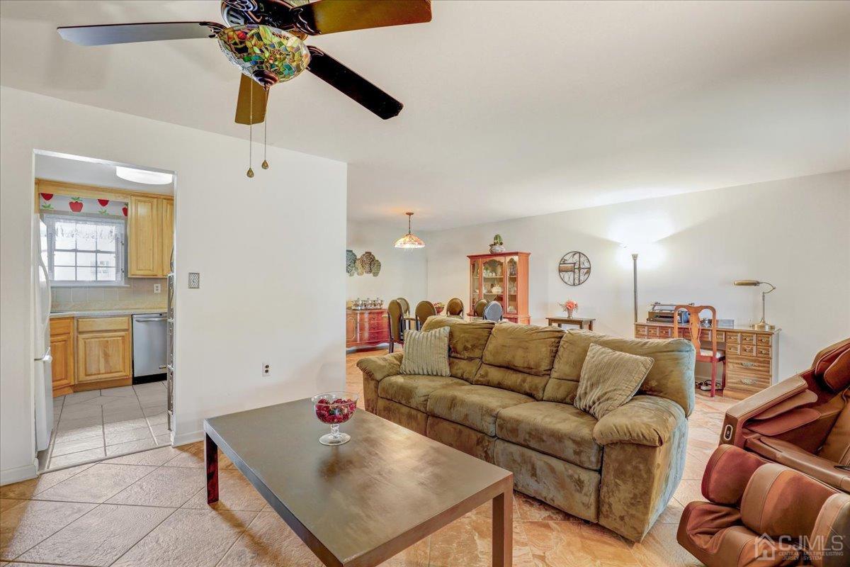 95 Neilly Court Old Bridge, NJ 08857 - Photo 10 of 35 a living room with furniture and a table