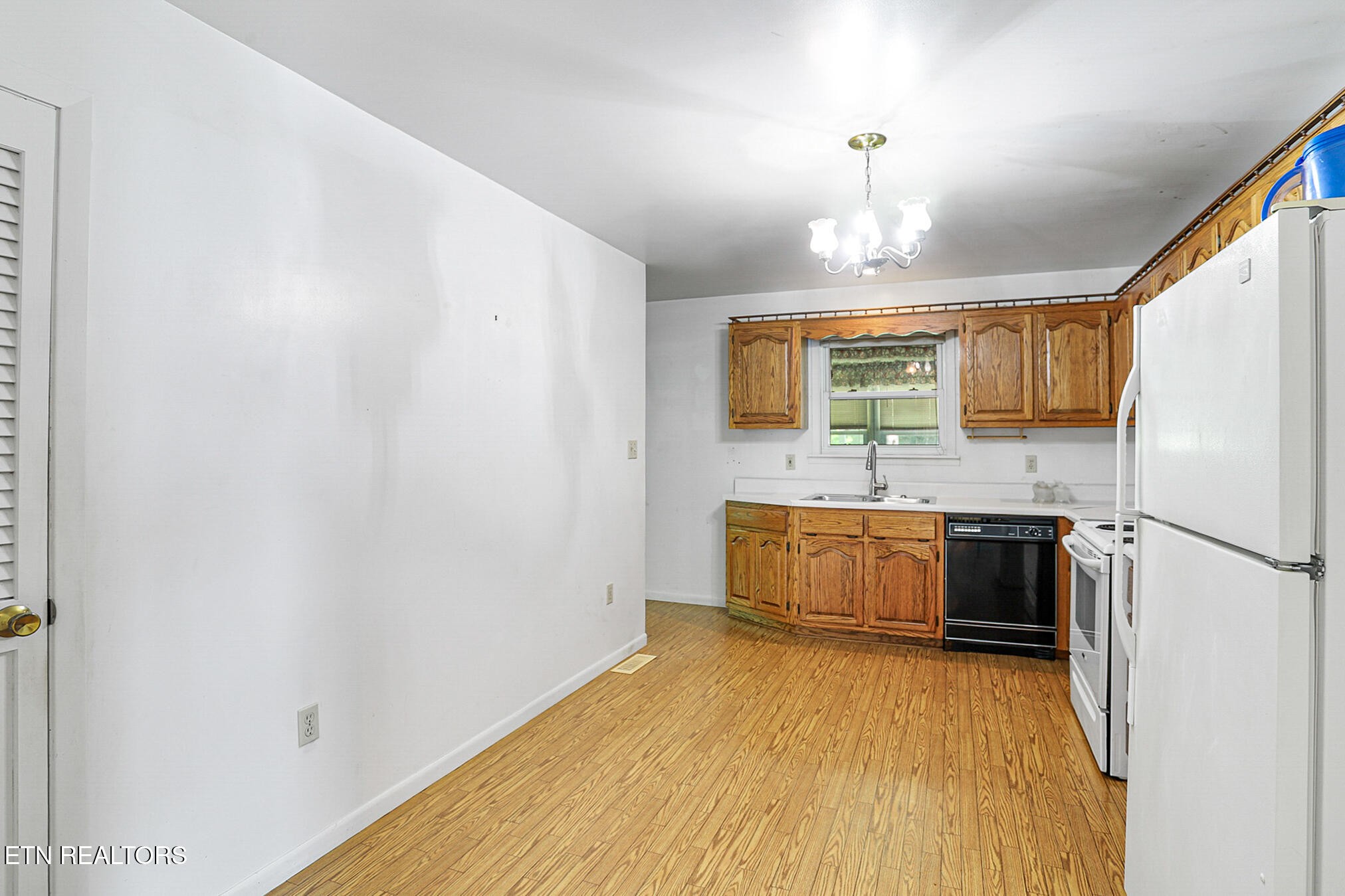 2015 Carolyn Drive Jefferson City, TN 37760 - Photo 16 of 44 a kitchen with a refrigerator a stove top oven a sink and dishwasher