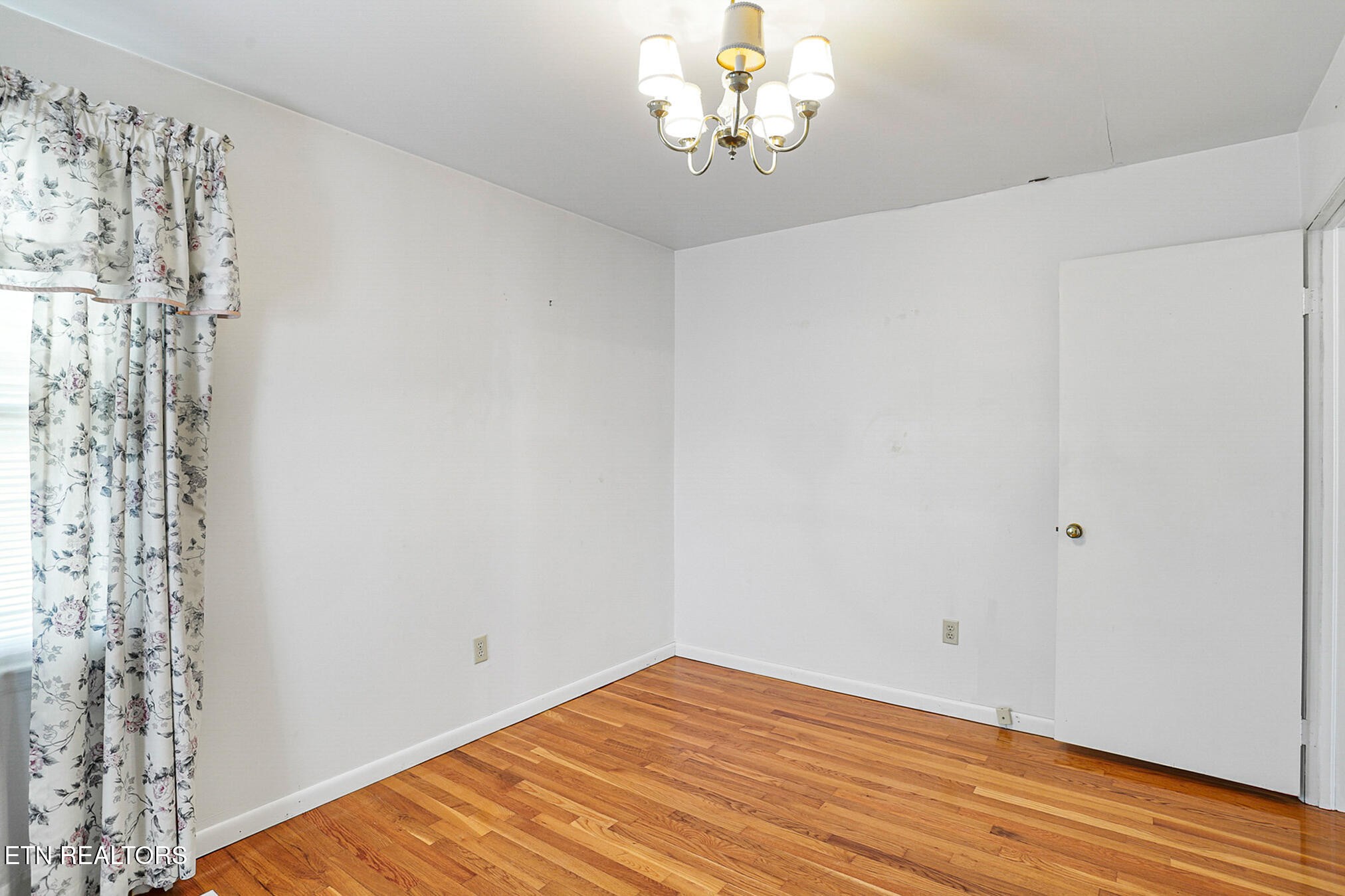2015 Carolyn Drive Jefferson City, TN 37760 - Photo 29 of 44 a view of a room with wooden floor and chandelier