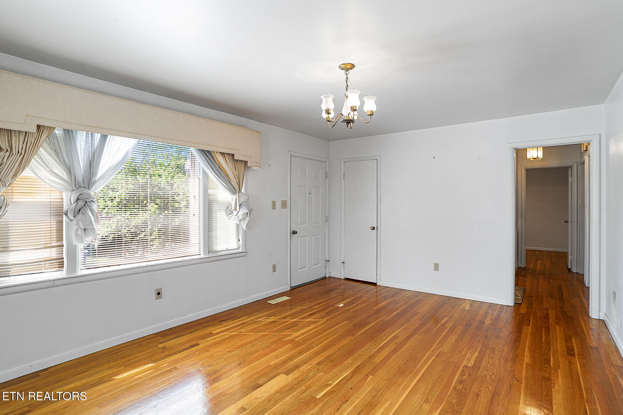 2015 Carolyn Drive Jefferson City, TN 37760 - Photo 3 of 44 a view of empty room with wooden floor and fan