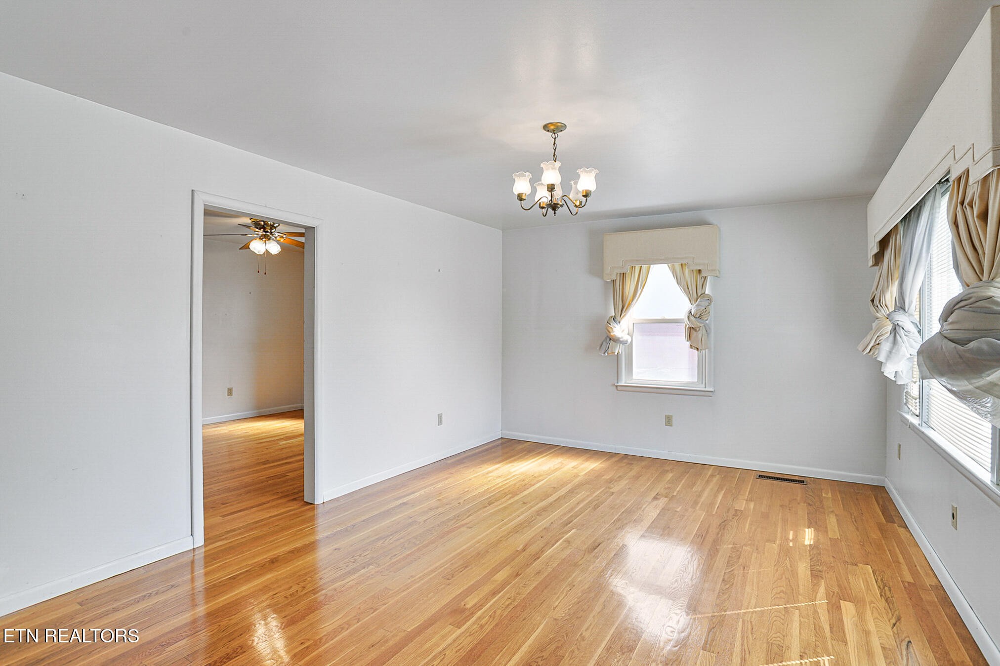 2015 Carolyn Drive Jefferson City, TN 37760 - Photo 4 of 44 wooden floor in an empty room with a window