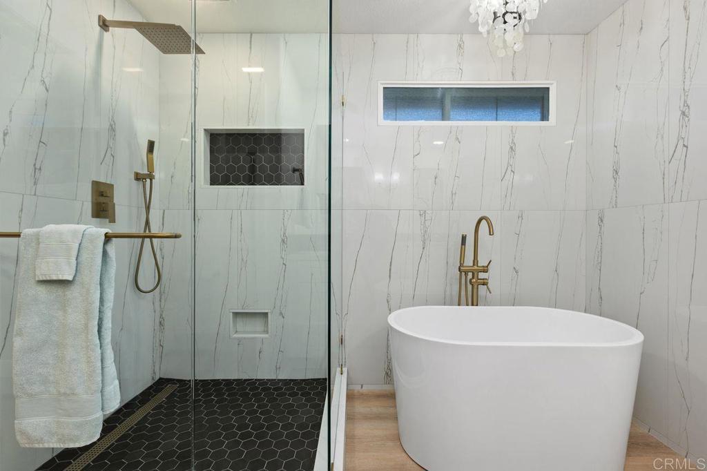 7039 Whitewater Street Carlsbad, CA 92011 - Photo 19 of 65 a bathroom with a sink a toilet and shower