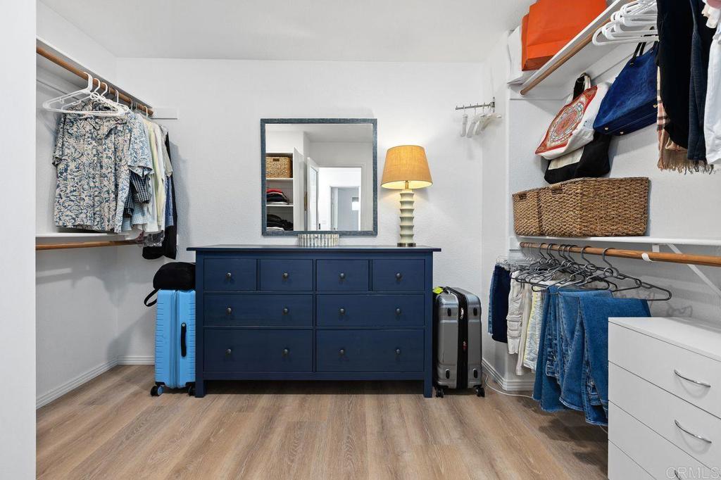 7039 Whitewater Street Carlsbad, CA 92011 - Photo 21 of 65 a room with a dresser and a mirror