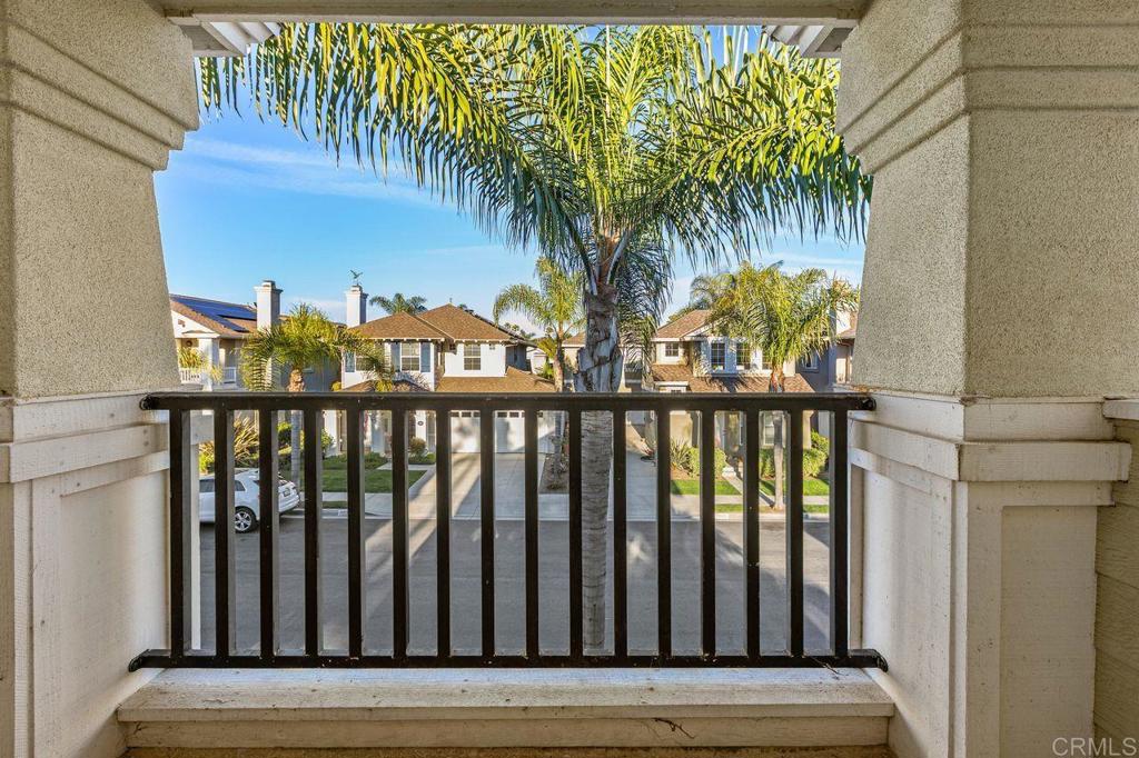 7039 Whitewater Street Carlsbad, CA 92011 - Photo 22 of 65 a view of a balcony with wooden floor