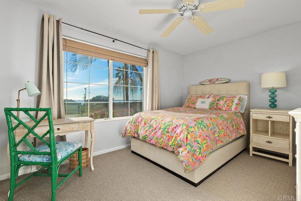7039 Whitewater Street Carlsbad, CA 92011 - Photo 27 of 65 a large bed sitting in a bedroom next to a window