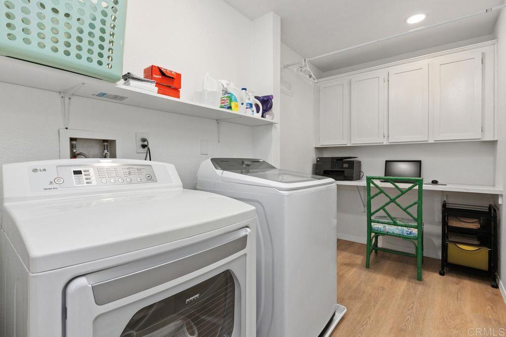 7039 Whitewater Street Carlsbad, CA 92011 - Photo 30 of 65 a utility room with dryer washer and closet