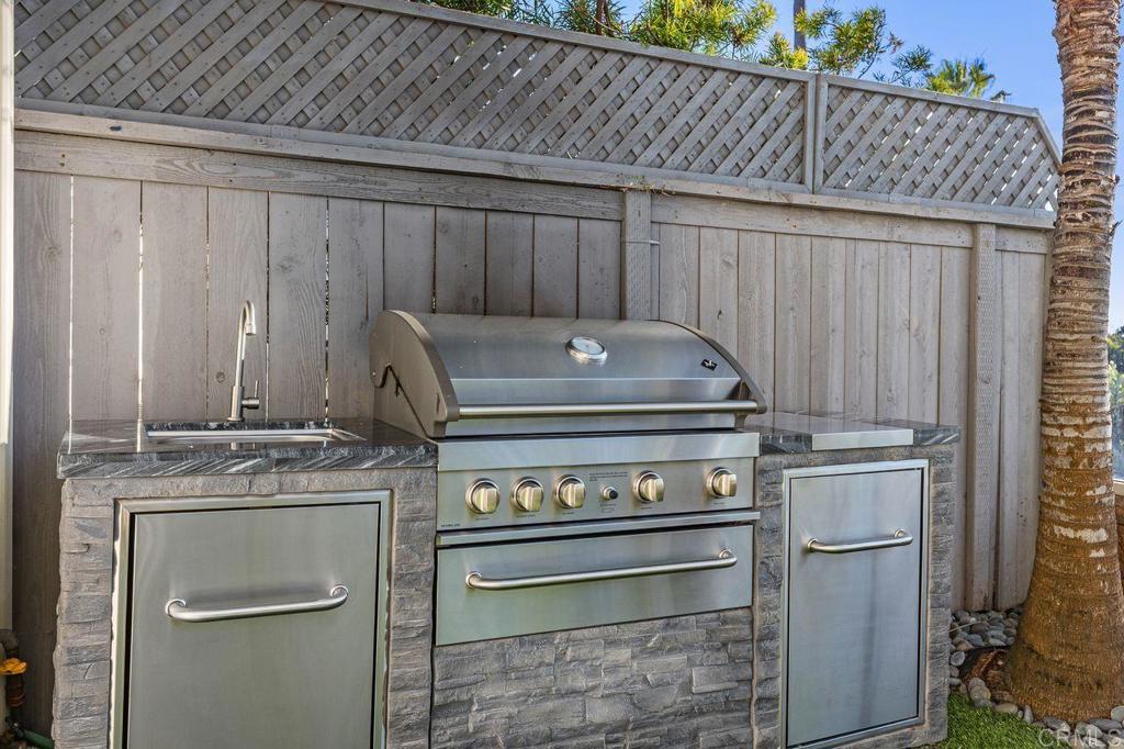 7039 Whitewater Street Carlsbad, CA 92011 - Photo 38 of 65 a stove top oven sitting inside of a kitchen