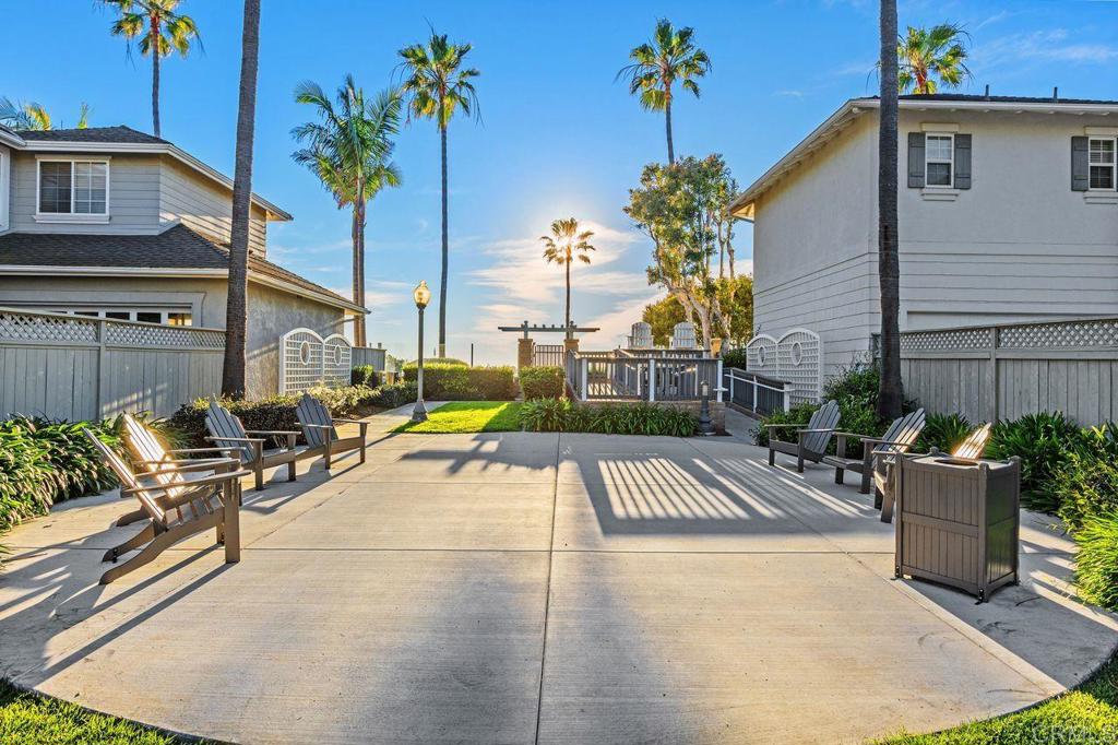 7039 Whitewater Street Carlsbad, CA 92011 - Photo 55 of 65 a view of swimming pool with outdoor seating and plants