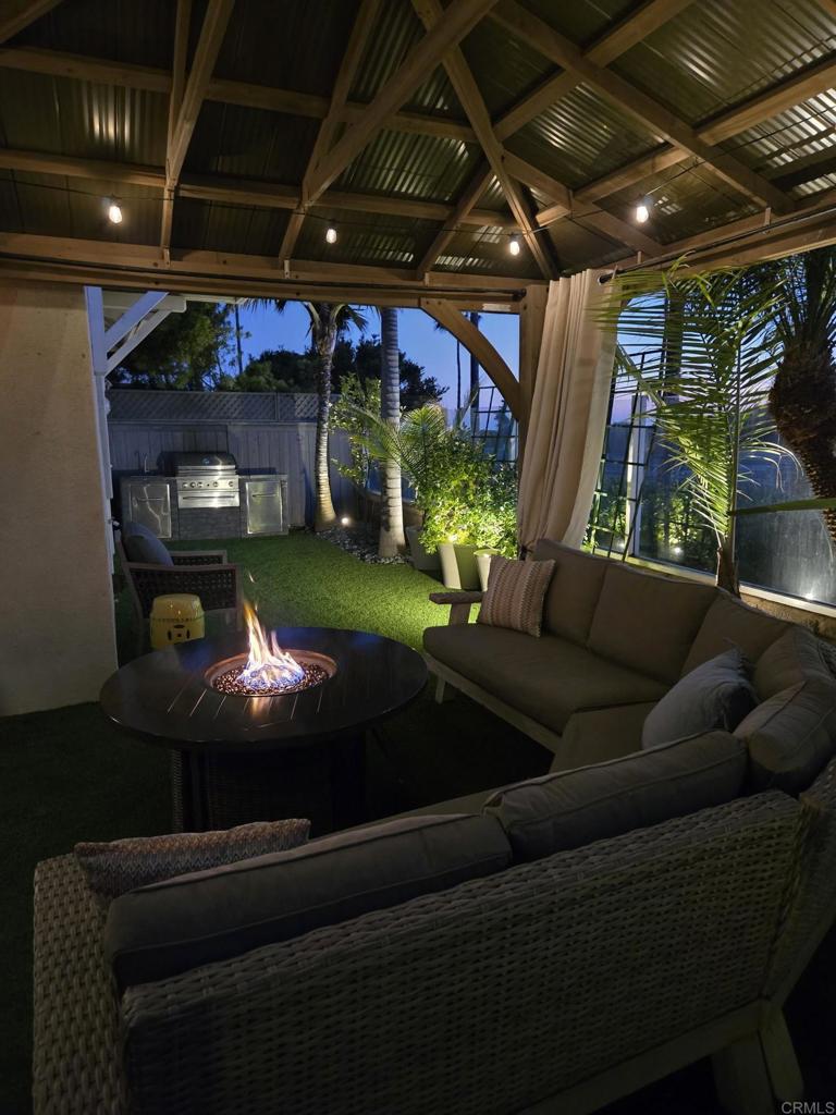 7039 Whitewater Street Carlsbad, CA 92011 - Photo 63 of 65 a living room with furniture and a garden