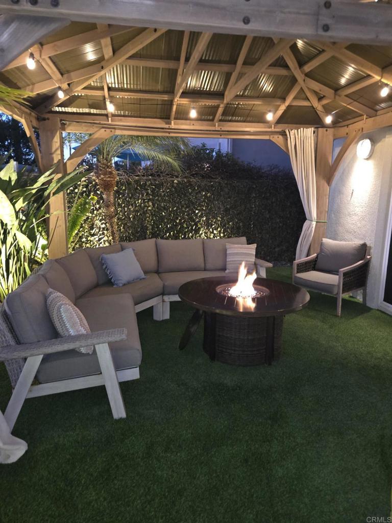 7039 Whitewater Street Carlsbad, CA 92011 - Photo 64 of 65 a outdoor living space with furniture and a fireplace