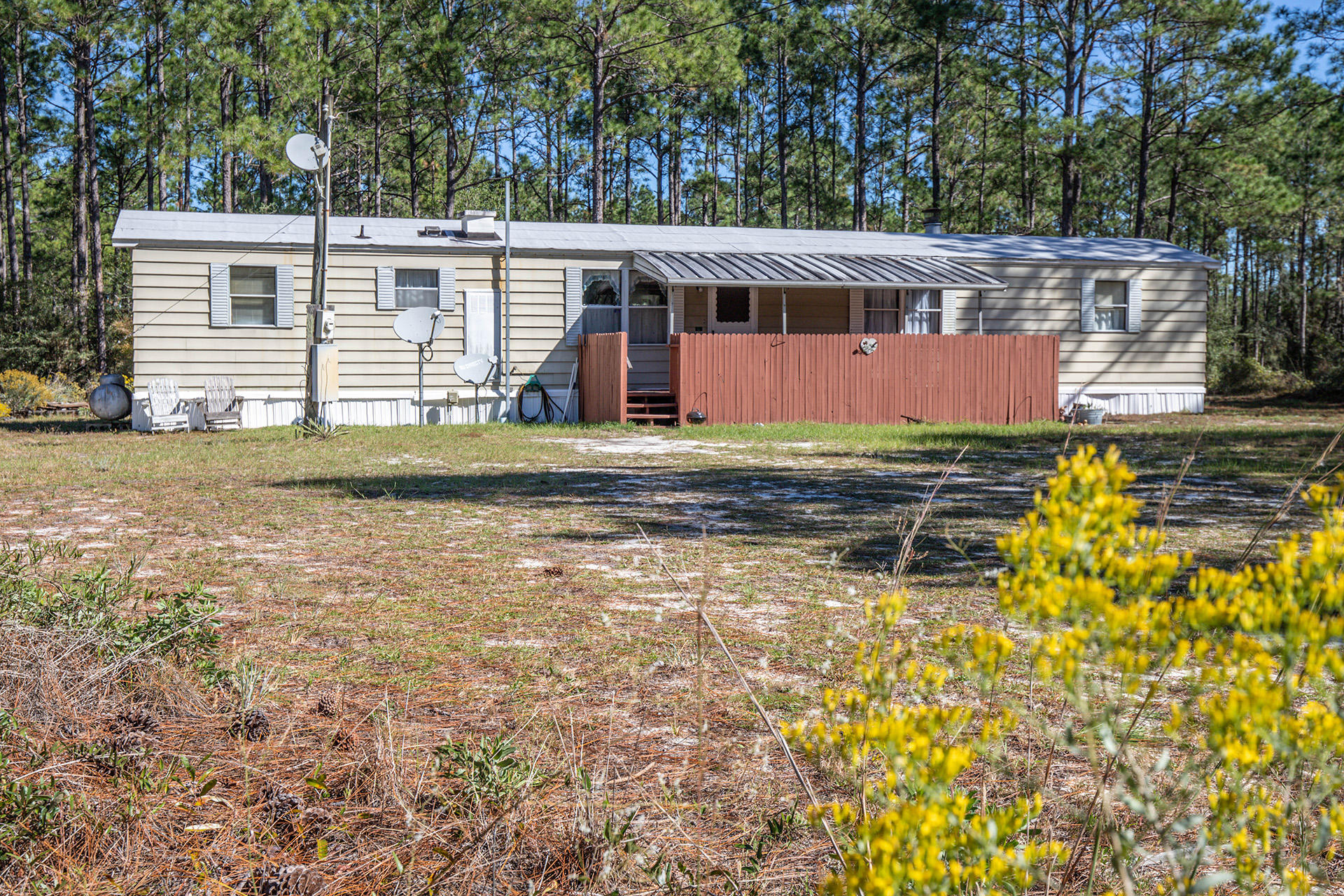 887 Don Graff Road Freeport, FL 32439 - Photo 3 of 17 a view of a house with a yard