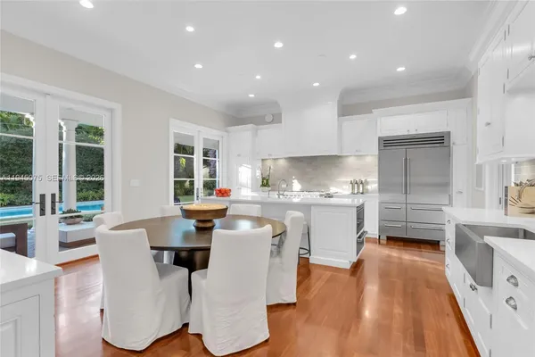 a kitchen with sink cabinets and wooden floor