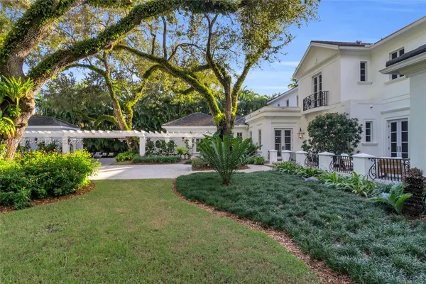 a view of a garden with a bench in a garden