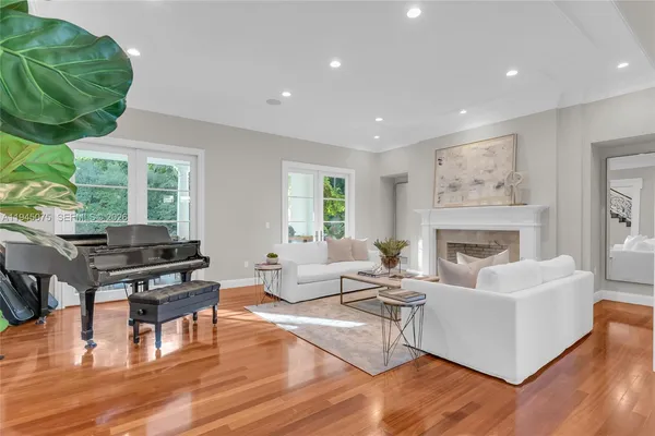 a living room with furniture fireplace and window