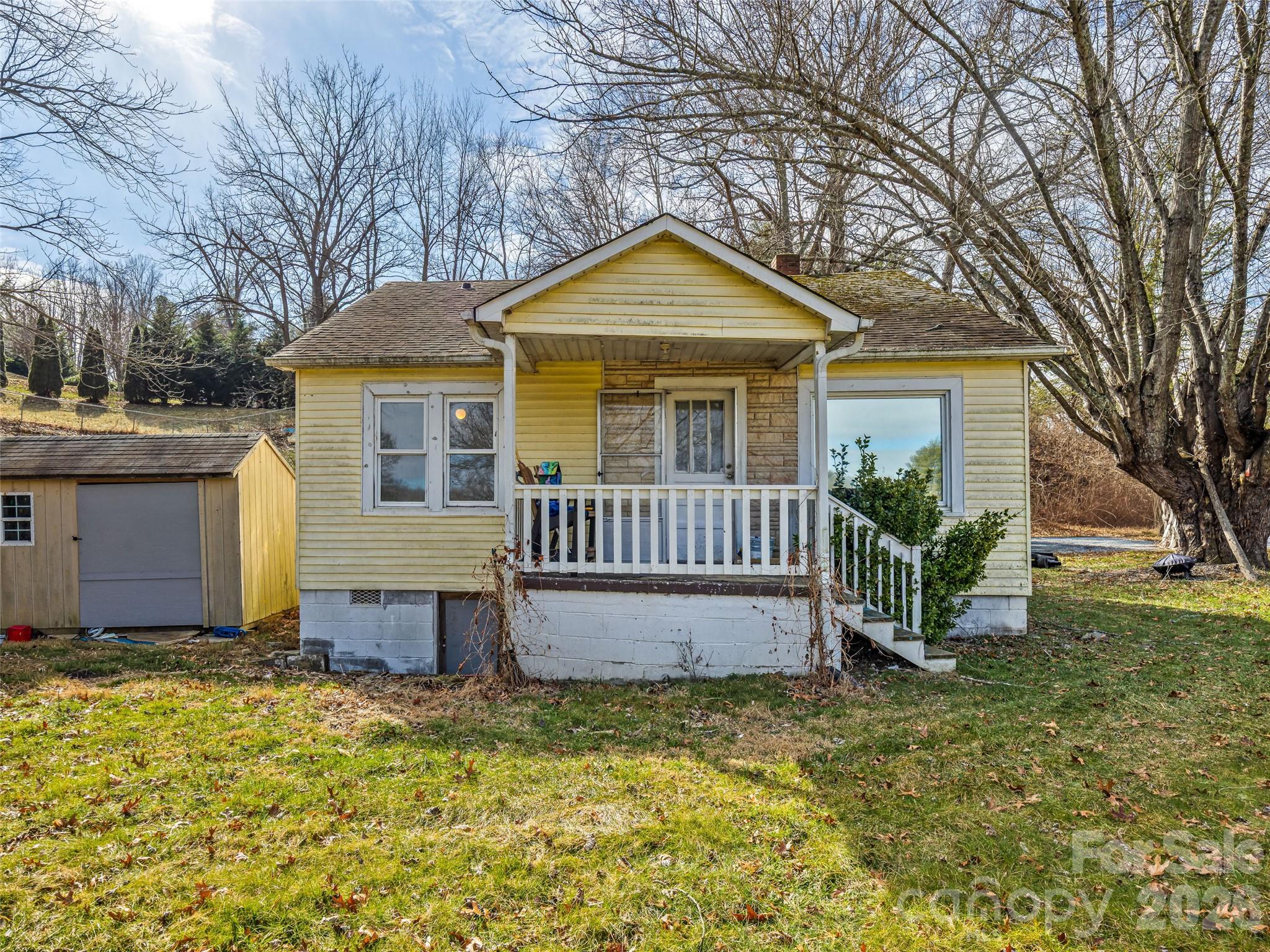 800 Murray Road Canton, NC 28716 - Photo 2 of 15 a view of a house with a yard and large tree
