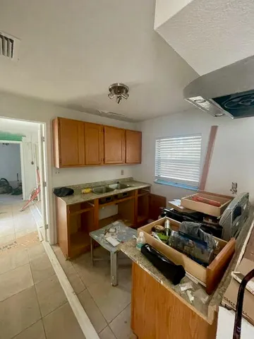 a view of a room with window and a ceiling fan