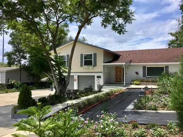 a front view of a house with garden