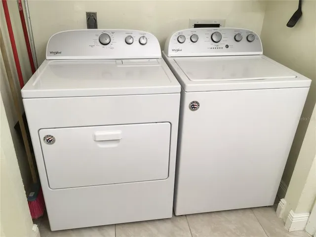 a utility room with washer and dryer