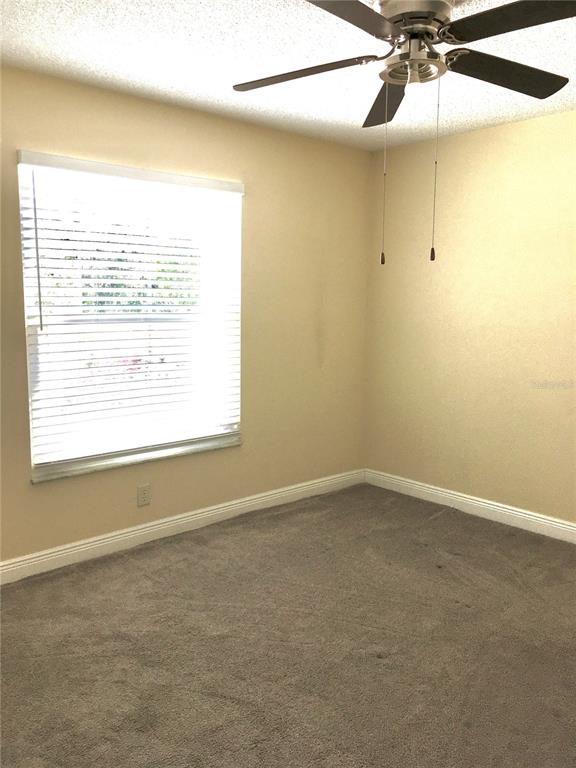 539 Libby Road Babson Park, FL 33827 - Photo 50 of 89 an empty room with a window and a fan