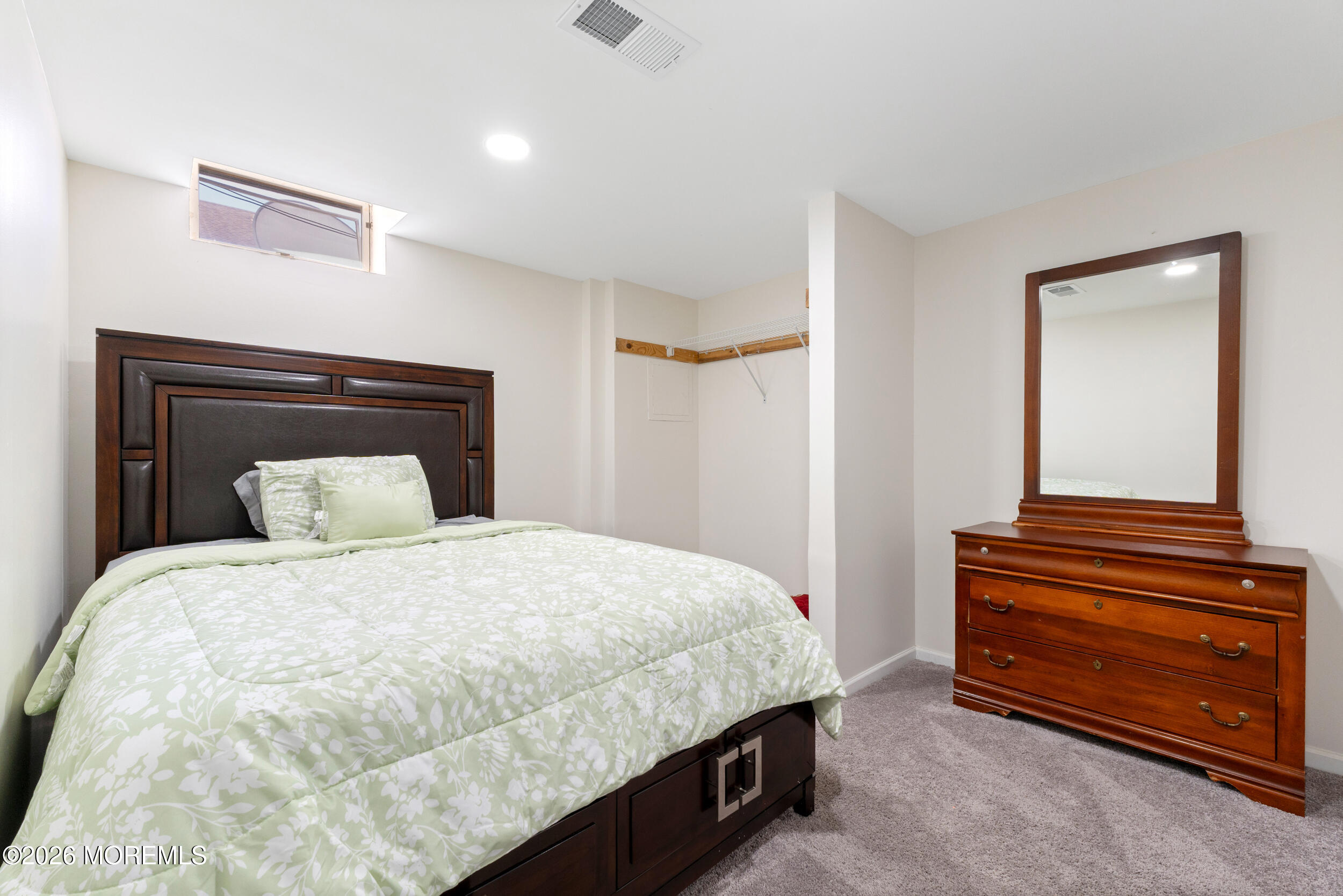 104 Autumn Road Matawan, NJ 07747 - Photo 47 of 64 a bedroom with a bed and a night stand