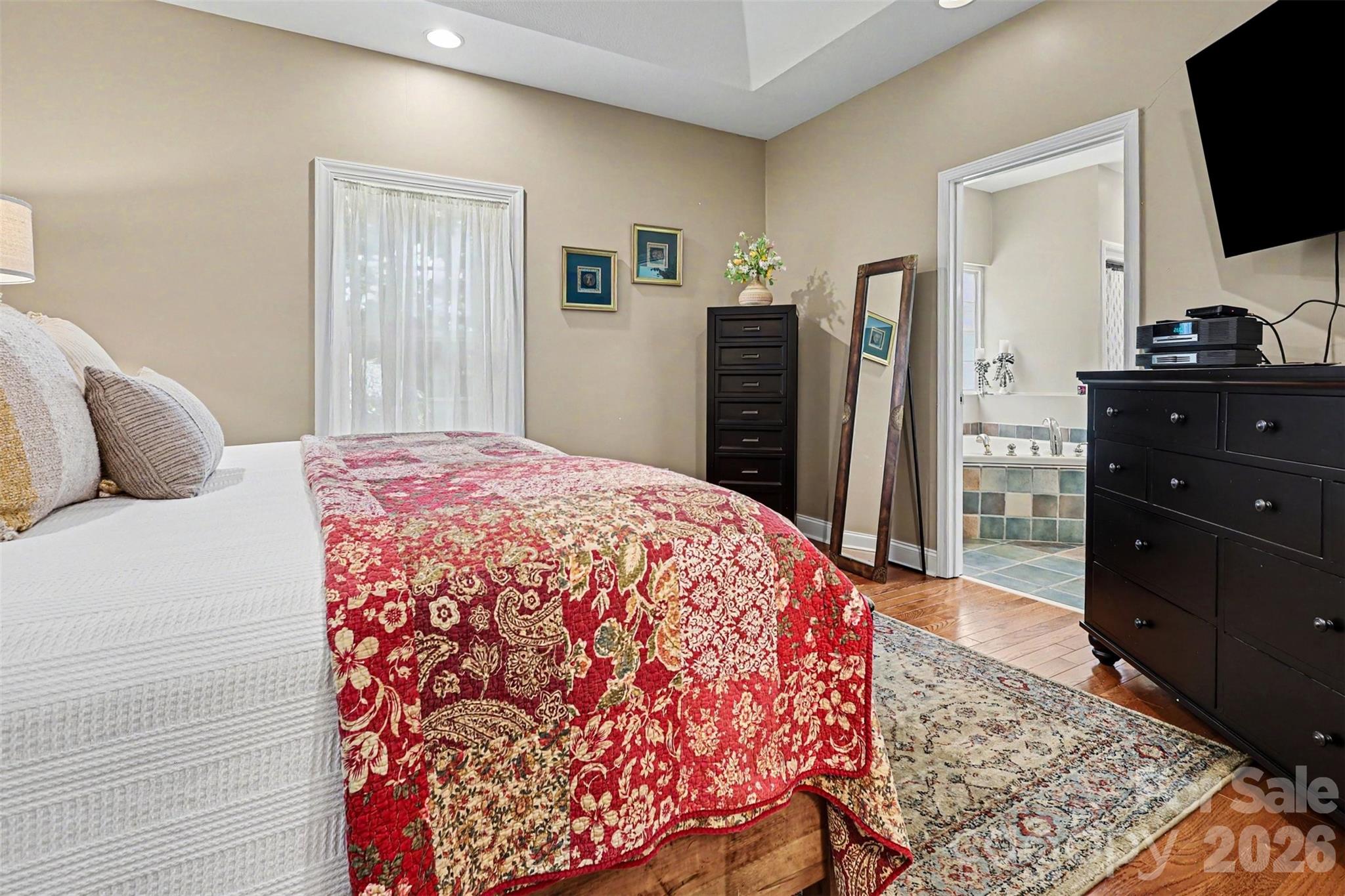4037 Old Williamston Road Belton, SC 29627 - Photo 17 of 41 a bedroom with a bed and a flat screen television