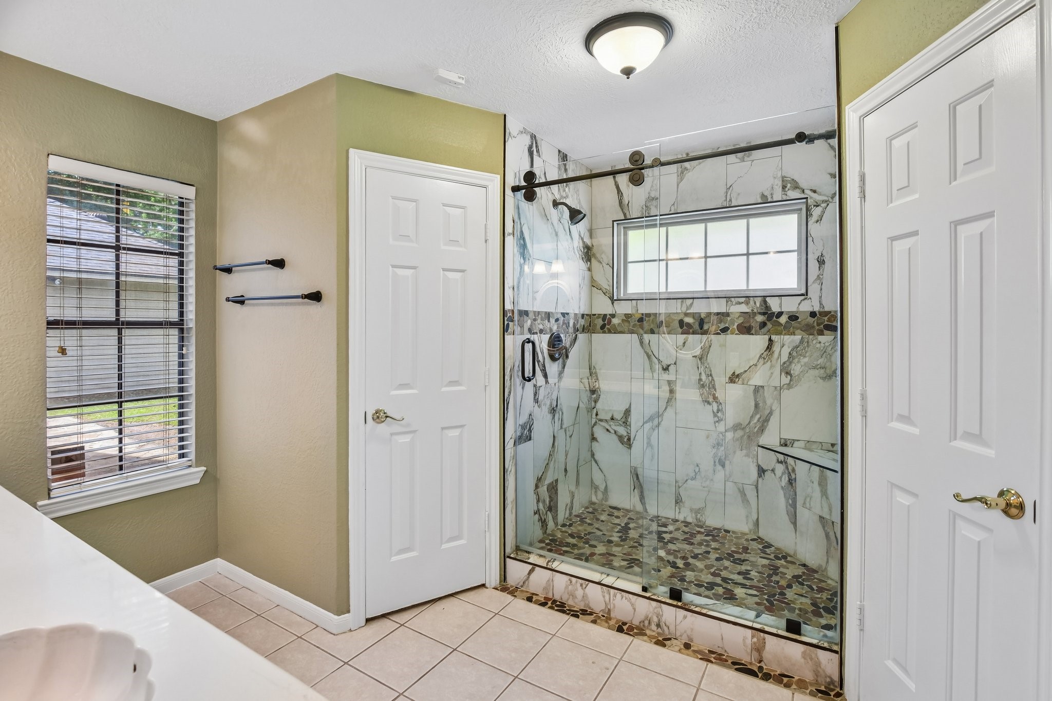 17703 Oaksham Lane Spring, TX 77379 - Photo 26 of 46 Separate Shower in Primary Bathroom Suite
