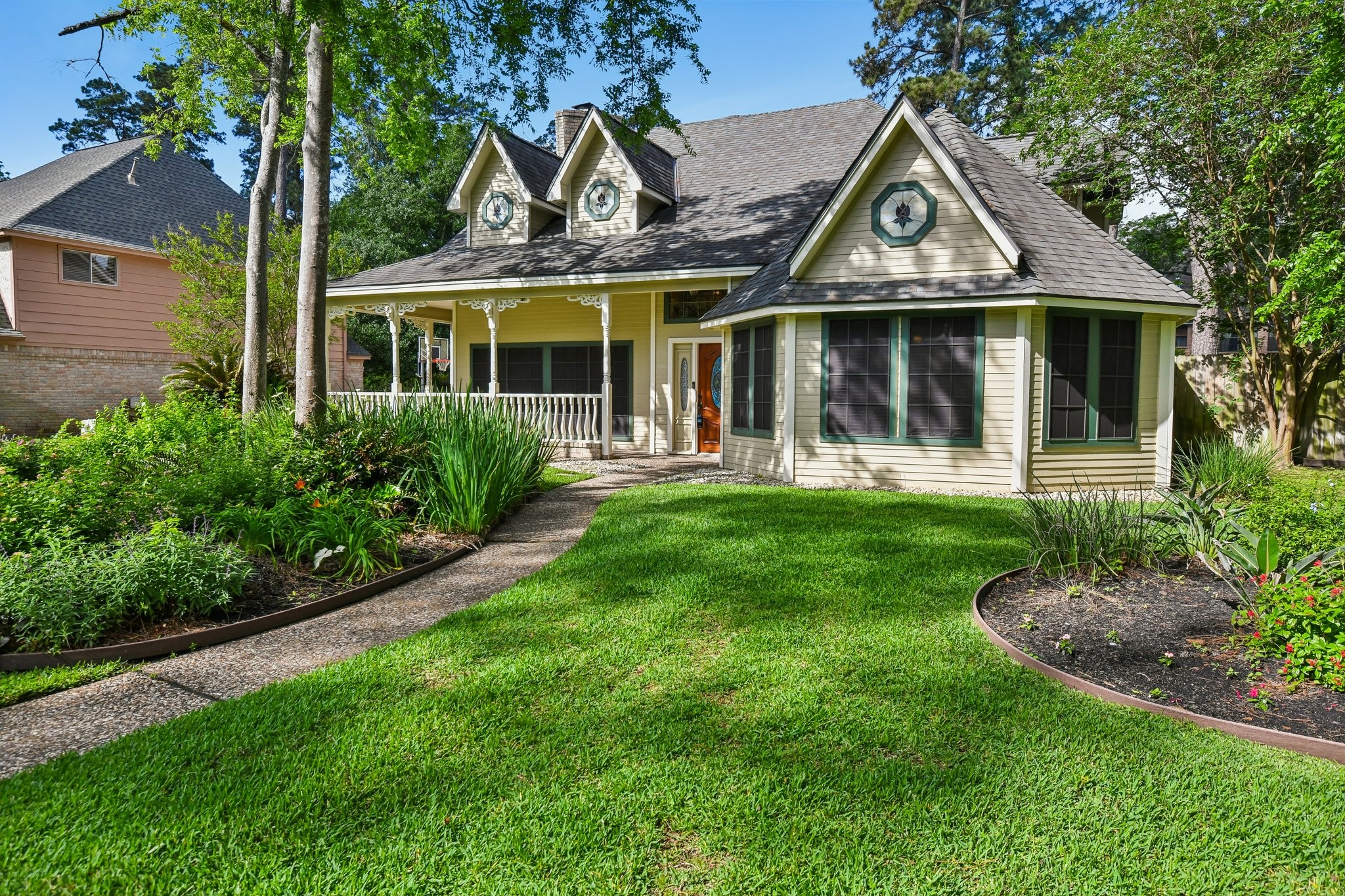 17703 Oaksham Lane Spring, TX 77379 - Photo 3 of 46 Lush landscaping and inviting Front Porch