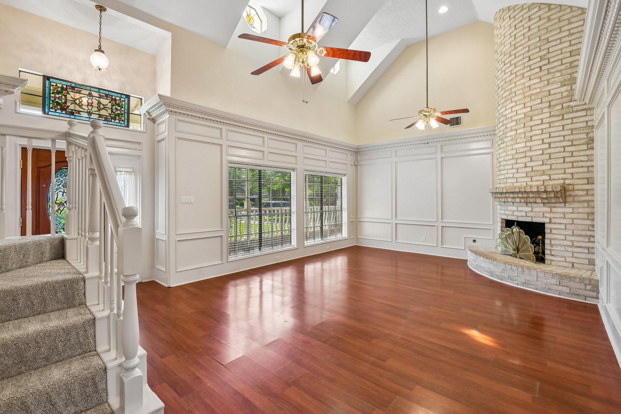 17703 Oaksham Lane Spring, TX 77379 - Photo 4 of 46 Spacious Den with great natural light through stained glass windows