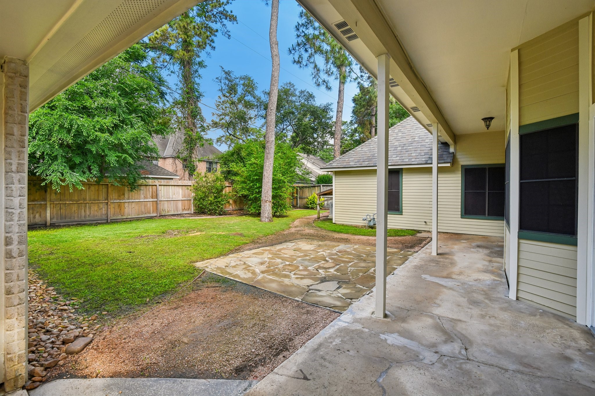 17703 Oaksham Lane Spring, TX 77379 - Photo 41 of 46 Covered Rear Patio with Mature Trees