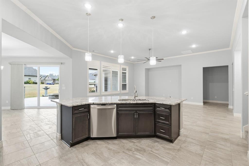 8813 Basanite Avenue Denton, TX 76207 - Photo 13 of 40 a large bathroom with a sink and cabinets
